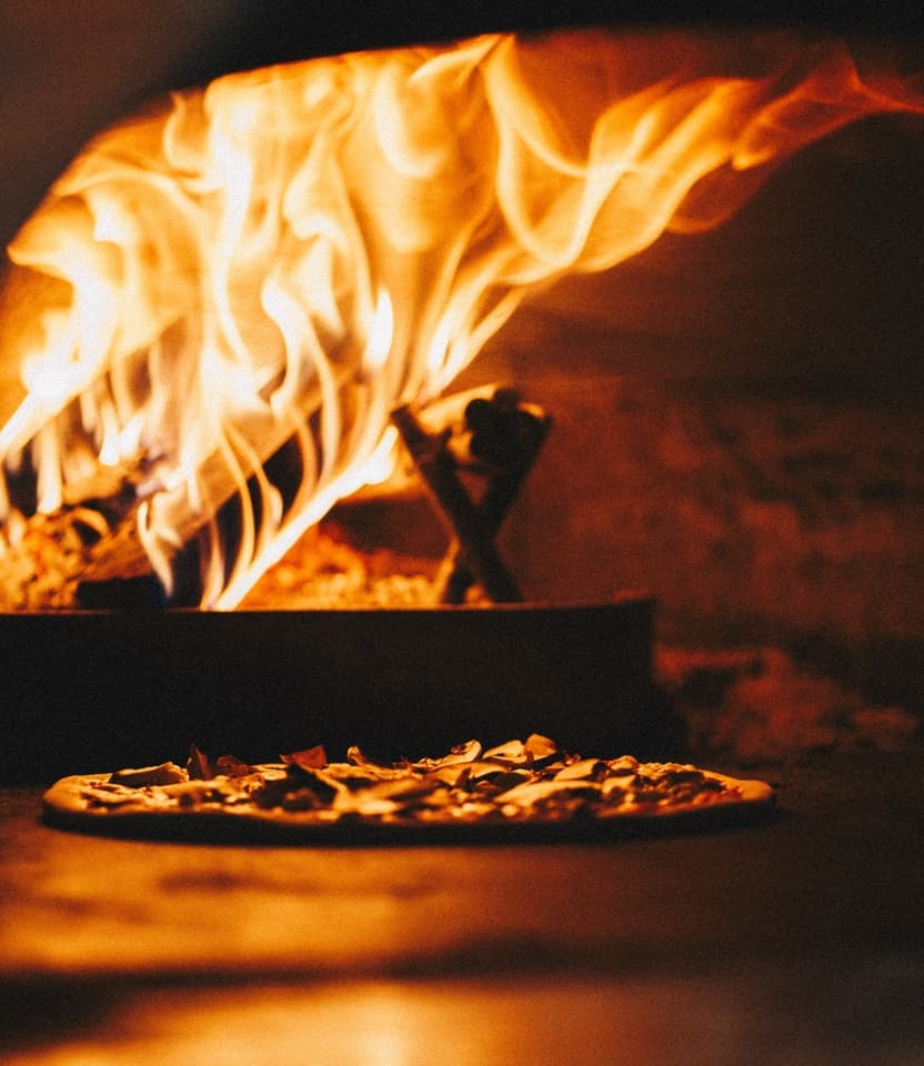 Cozy pizza evening with campfire